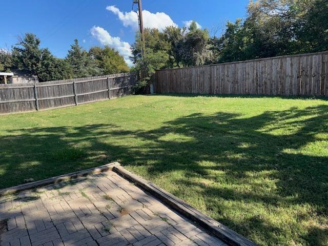 2700 Whetstone Drive Corinth, TX 76210 - Photo 12 of 12 a view of a backyard with a garden
