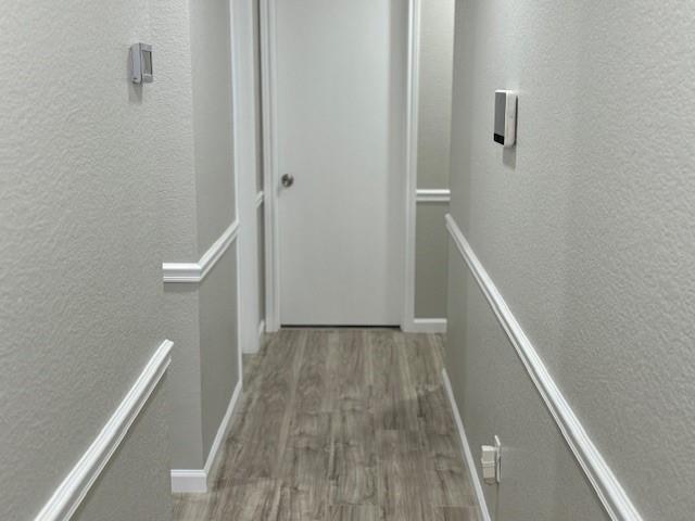 2700 Whetstone Drive Corinth, TX 76210 - Photo 5 of 12 a view of hallway with stairs and wooden floor