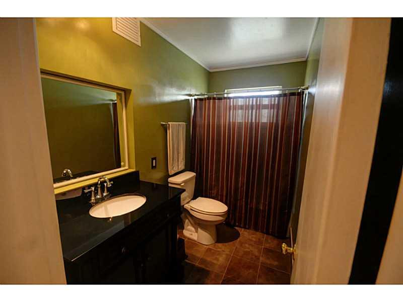 4441 Northeast 22nd Avenue Lighthouse Point, FL 33064 - Photo 14 of 18 a bathroom with a sink and a mirror