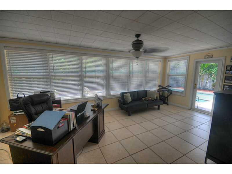 4441 Northeast 22nd Avenue Lighthouse Point, FL 33064 - Photo 8 of 18 a living room with furniture and a window