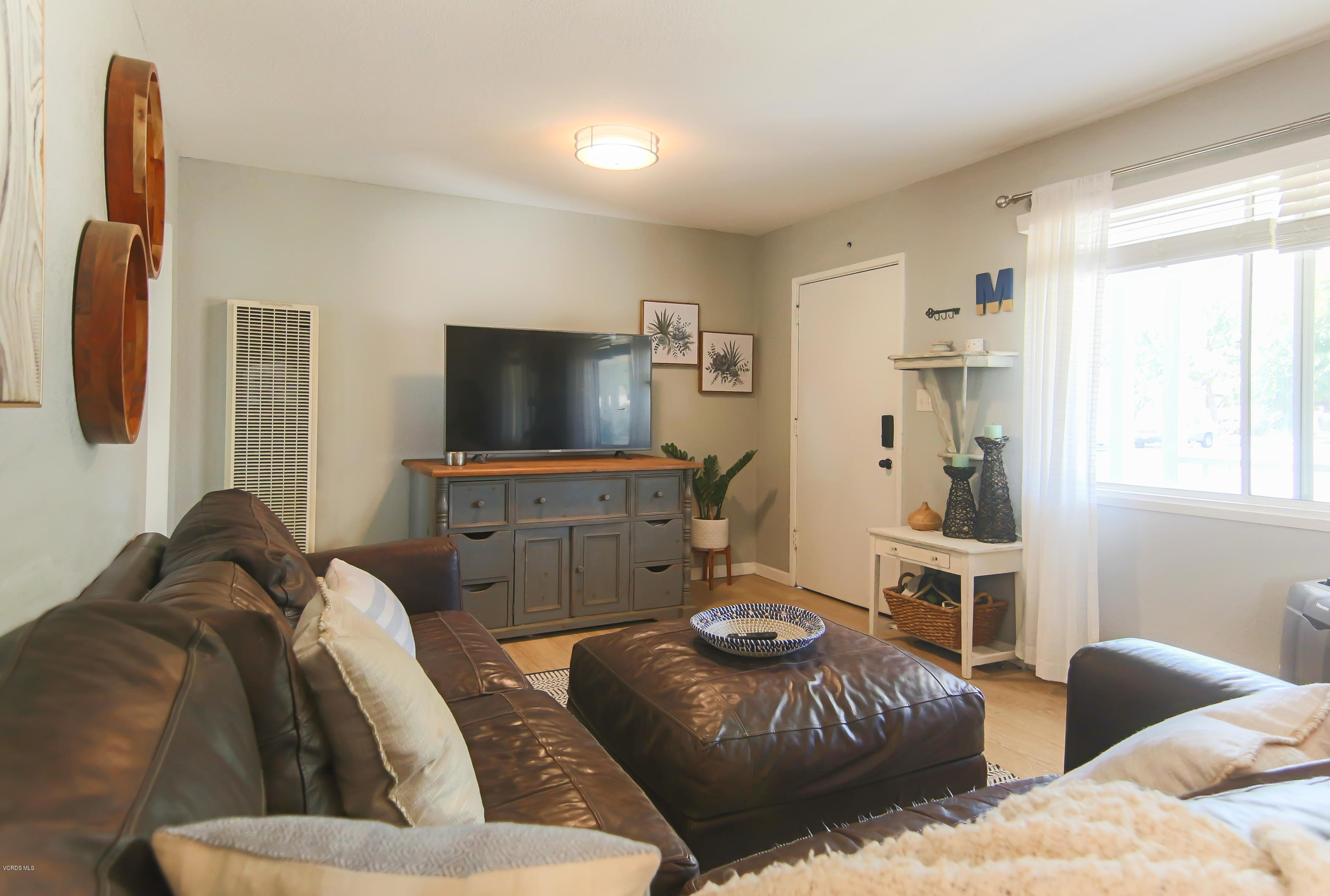 108 Drown Avenue Ojai, CA 93023 - Photo 11 of 37 a living room with furniture and a flat screen tv