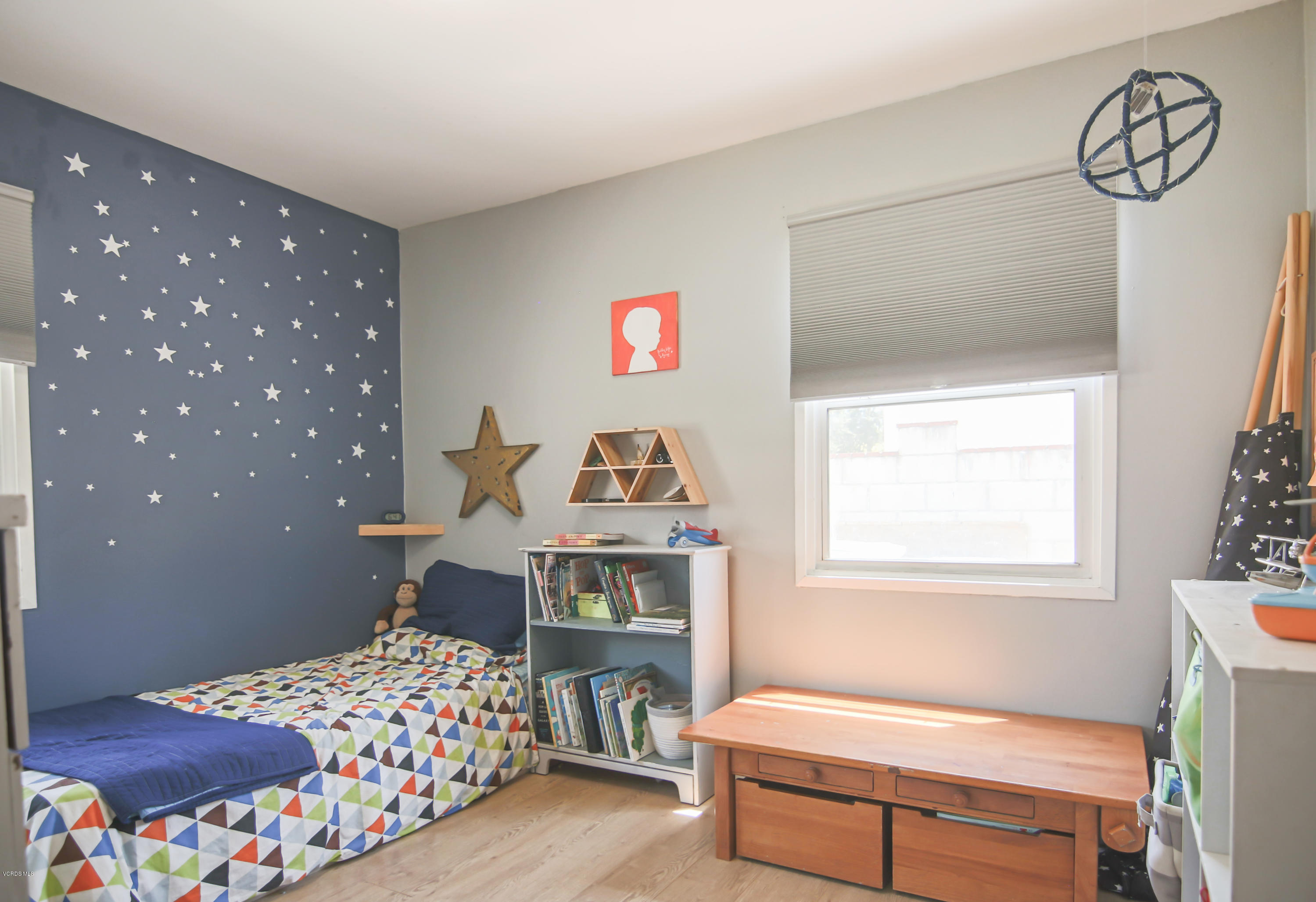 108 Drown Avenue Ojai, CA 93023 - Photo 15 of 37 a bedroom with a bed and wooden floor