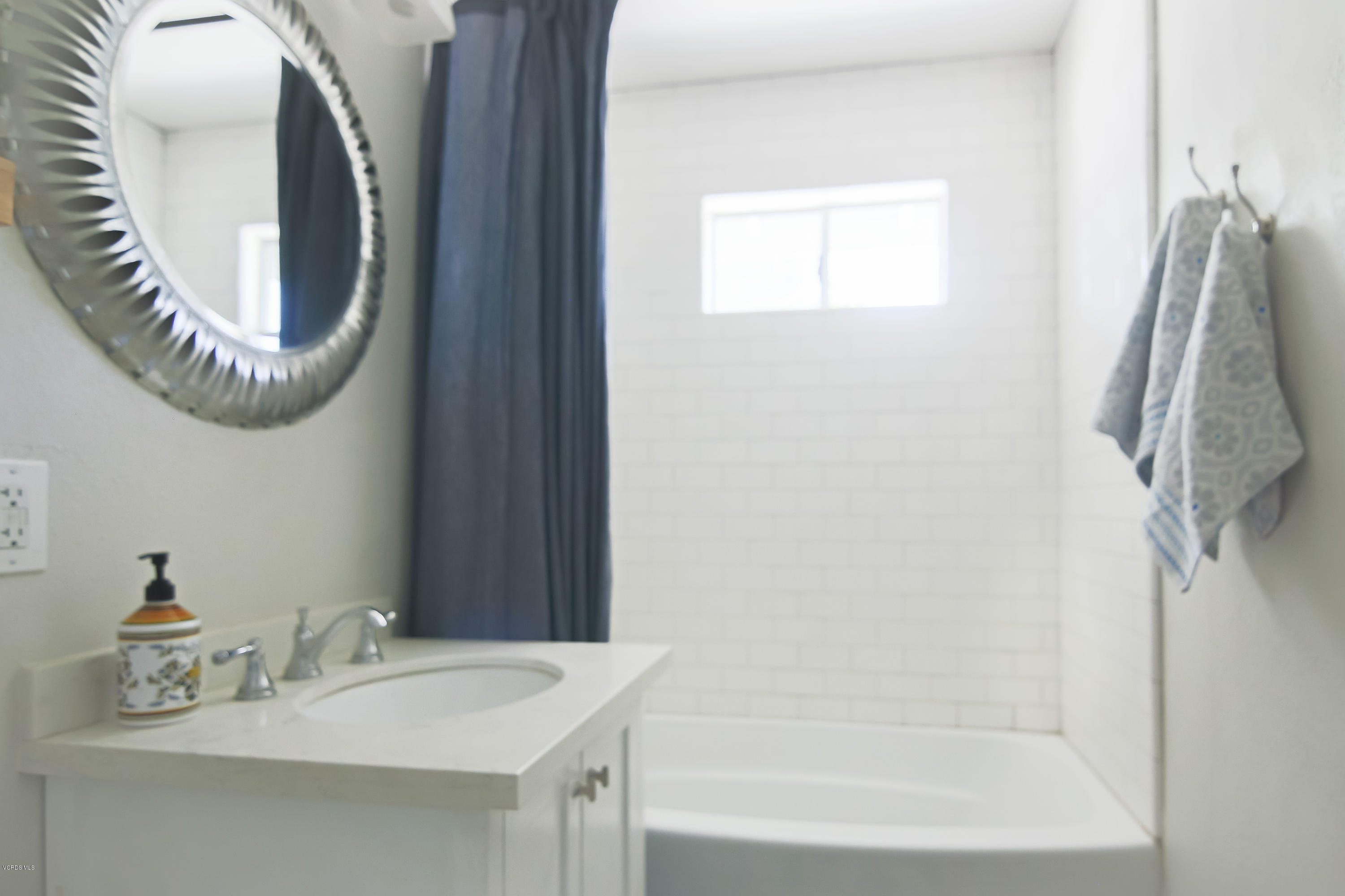 108 Drown Avenue Ojai, CA 93023 - Photo 16 of 37 a bathroom with a sink a mirror and a bathtub