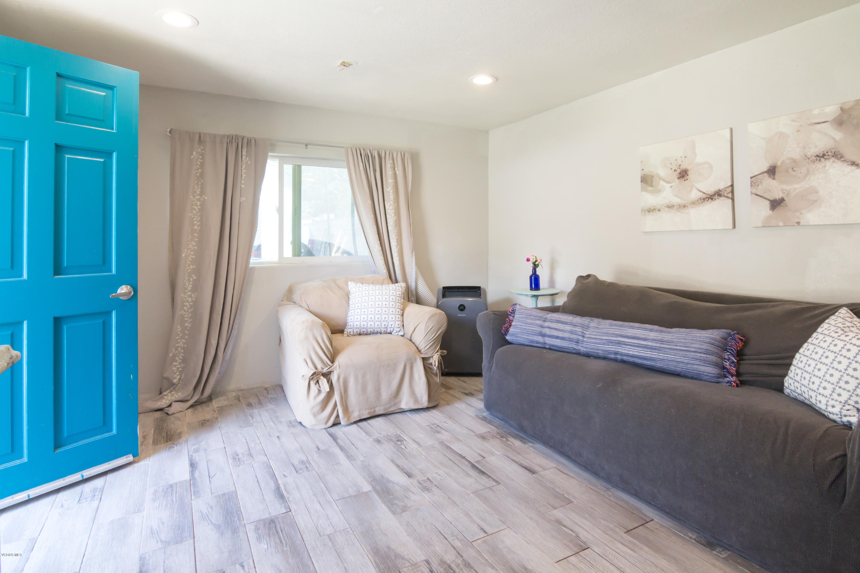 108 Drown Avenue Ojai, CA 93023 - Photo 22 of 37 a living room with furniture and a window