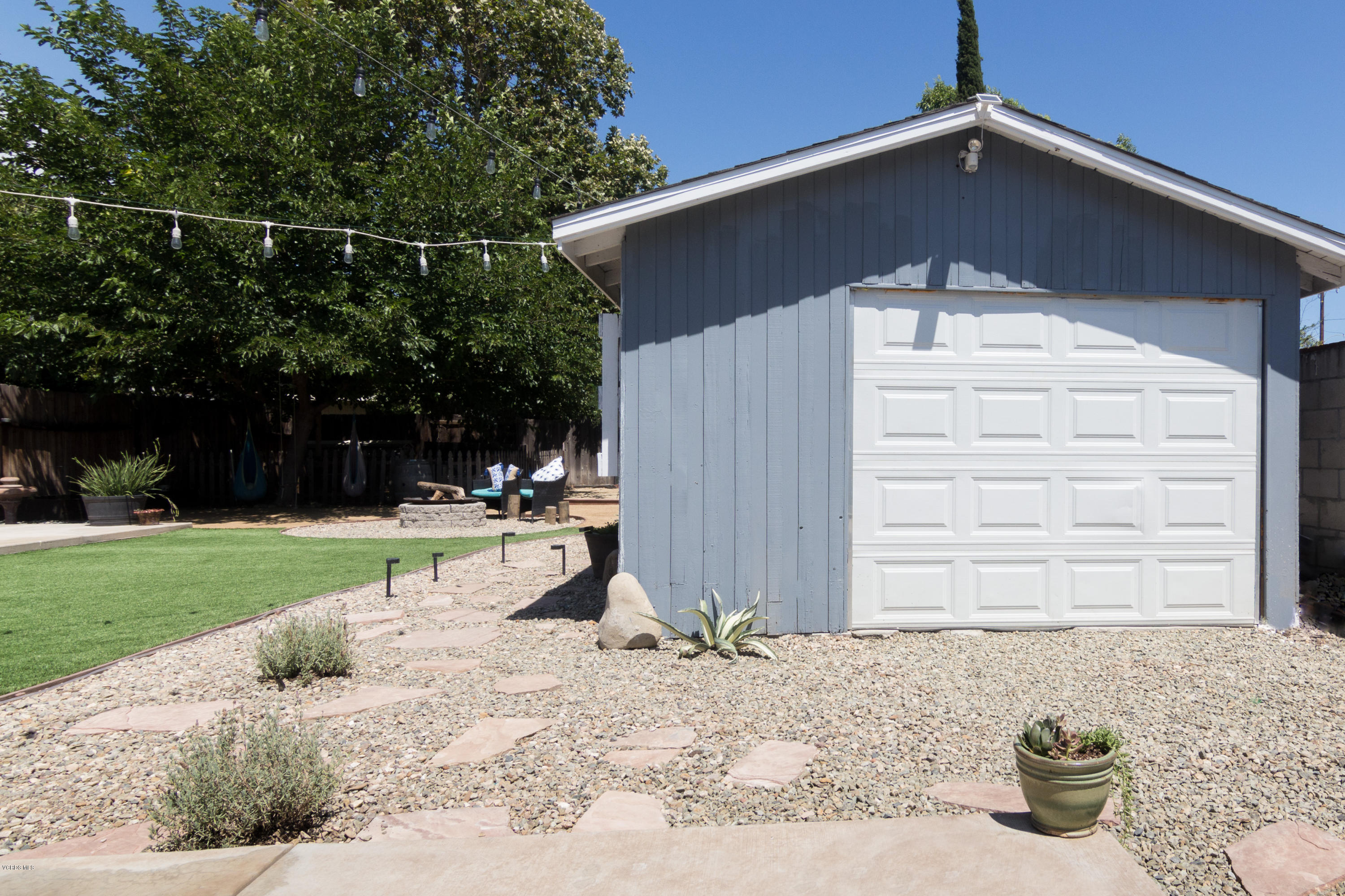 108 Drown Avenue Ojai, CA 93023 - Photo 32 of 37 a backyard of a house with plants and wooden fence