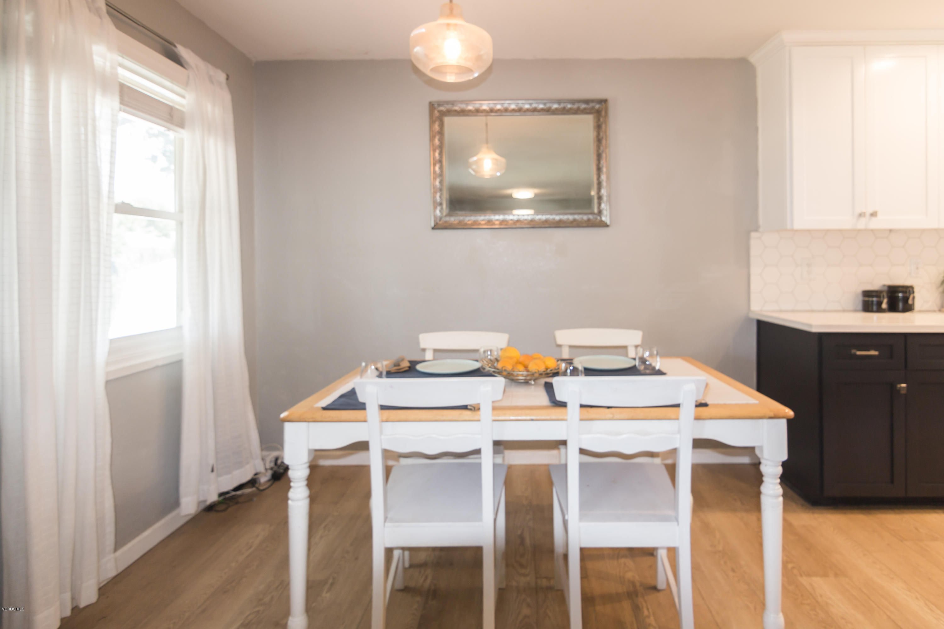 108 Drown Avenue Ojai, CA 93023 - Photo 5 of 37 a dining room with a table chairs and a window
