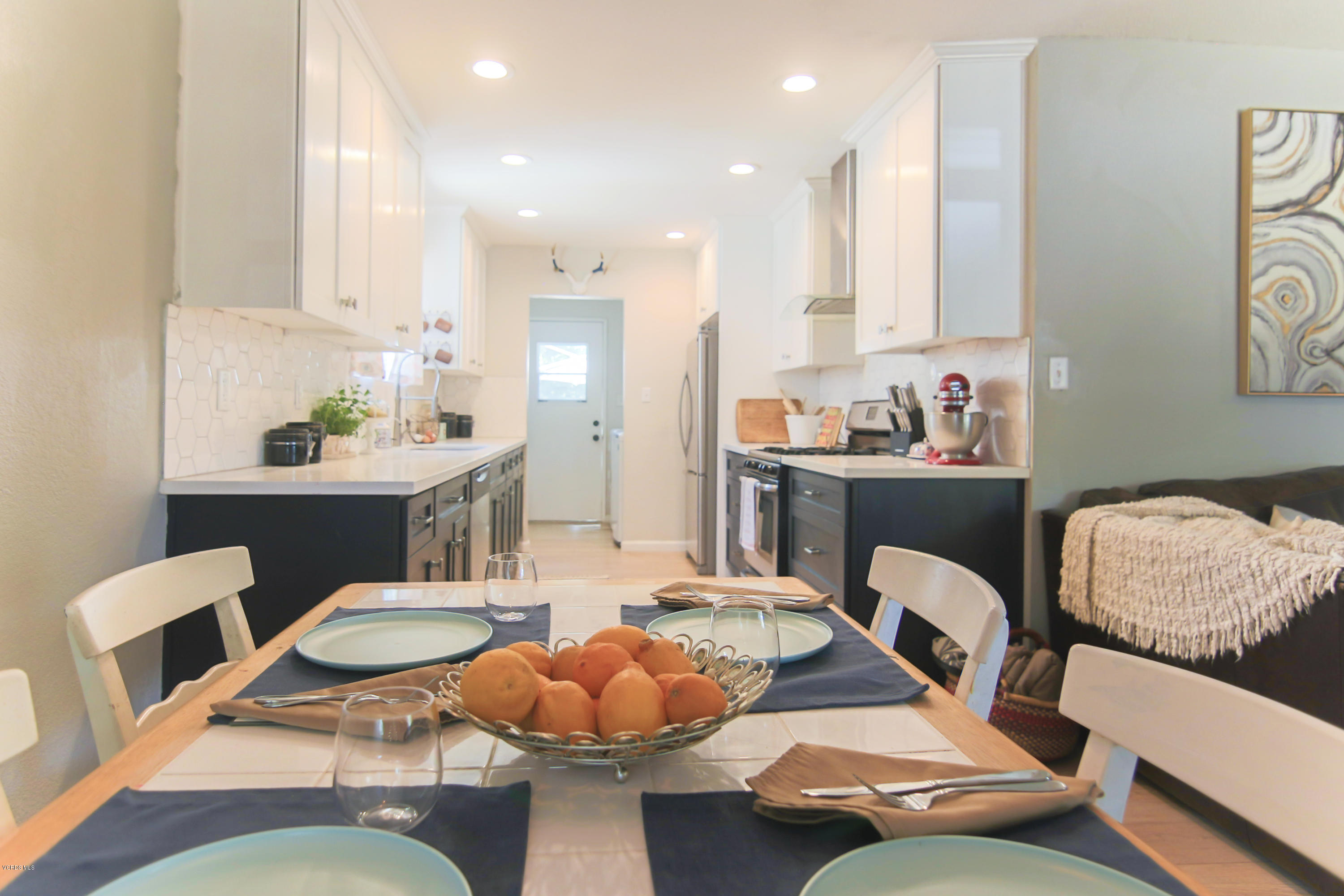 108 Drown Avenue Ojai, CA 93023 - Photo 6 of 37 a living room with furniture kitchen view and a chandelier