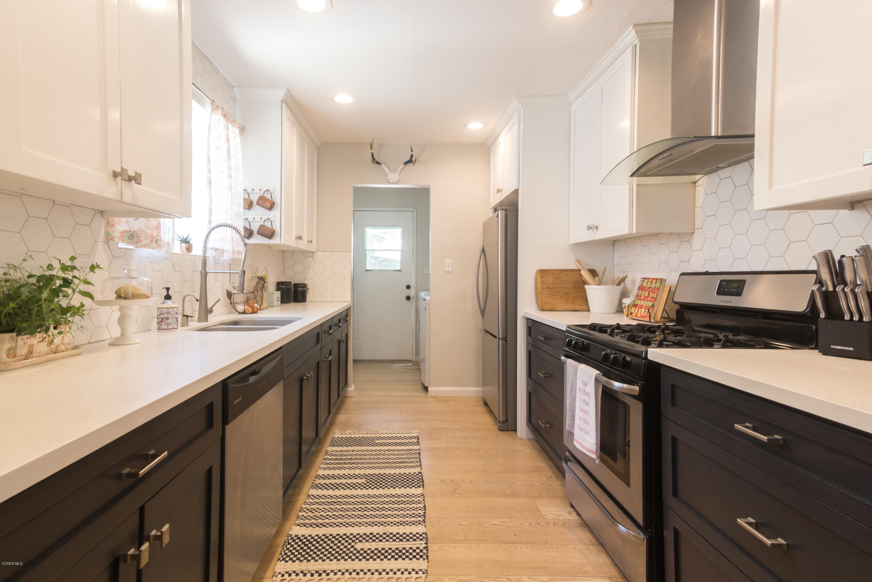 108 Drown Avenue Ojai, CA 93023 - Photo 7 of 37 a kitchen with stainless steel appliances a sink stove and cabinets