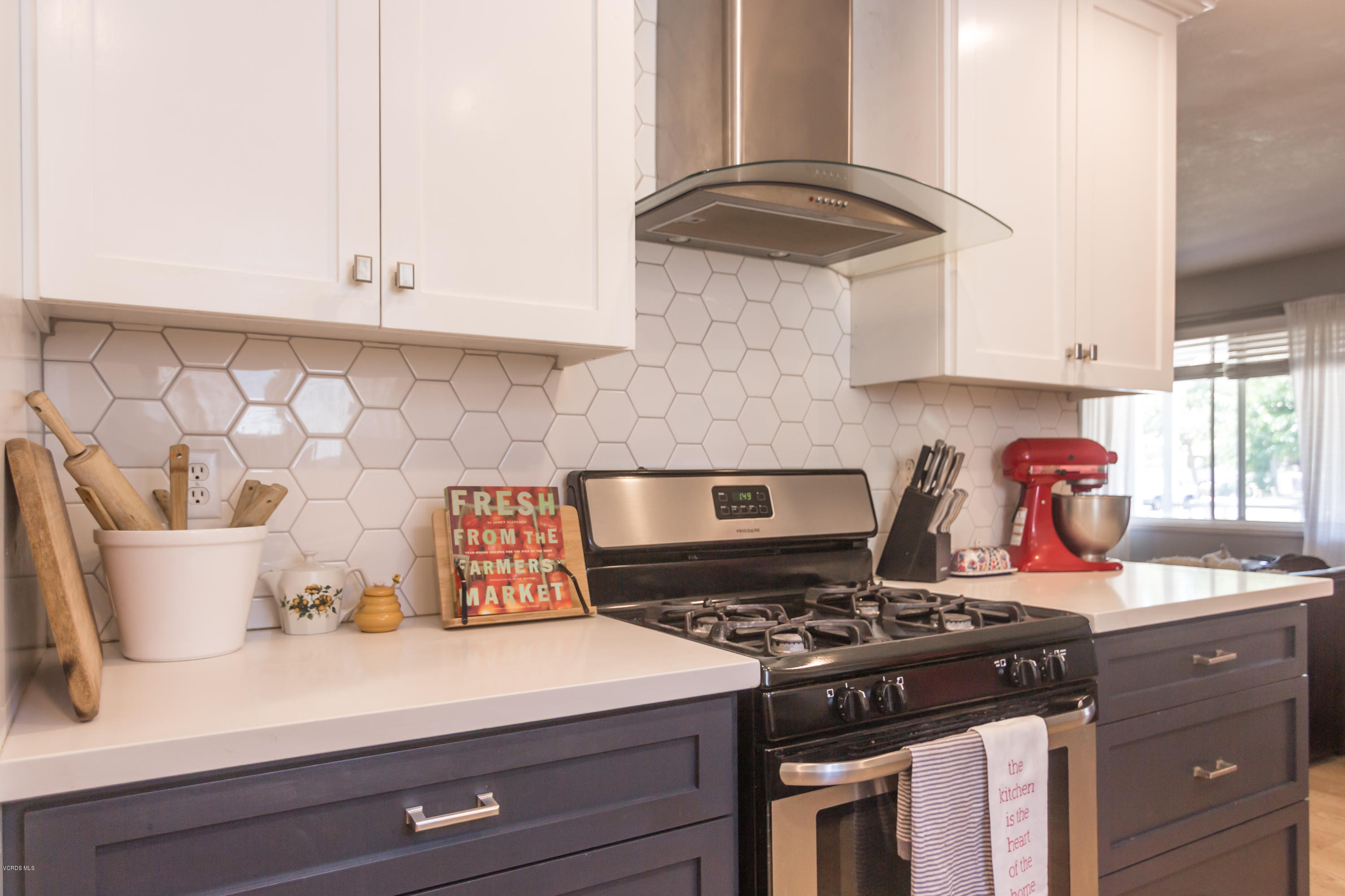 108 Drown Avenue Ojai, CA 93023 - Photo 8 of 37 a kitchen with a stove and a white cabinets