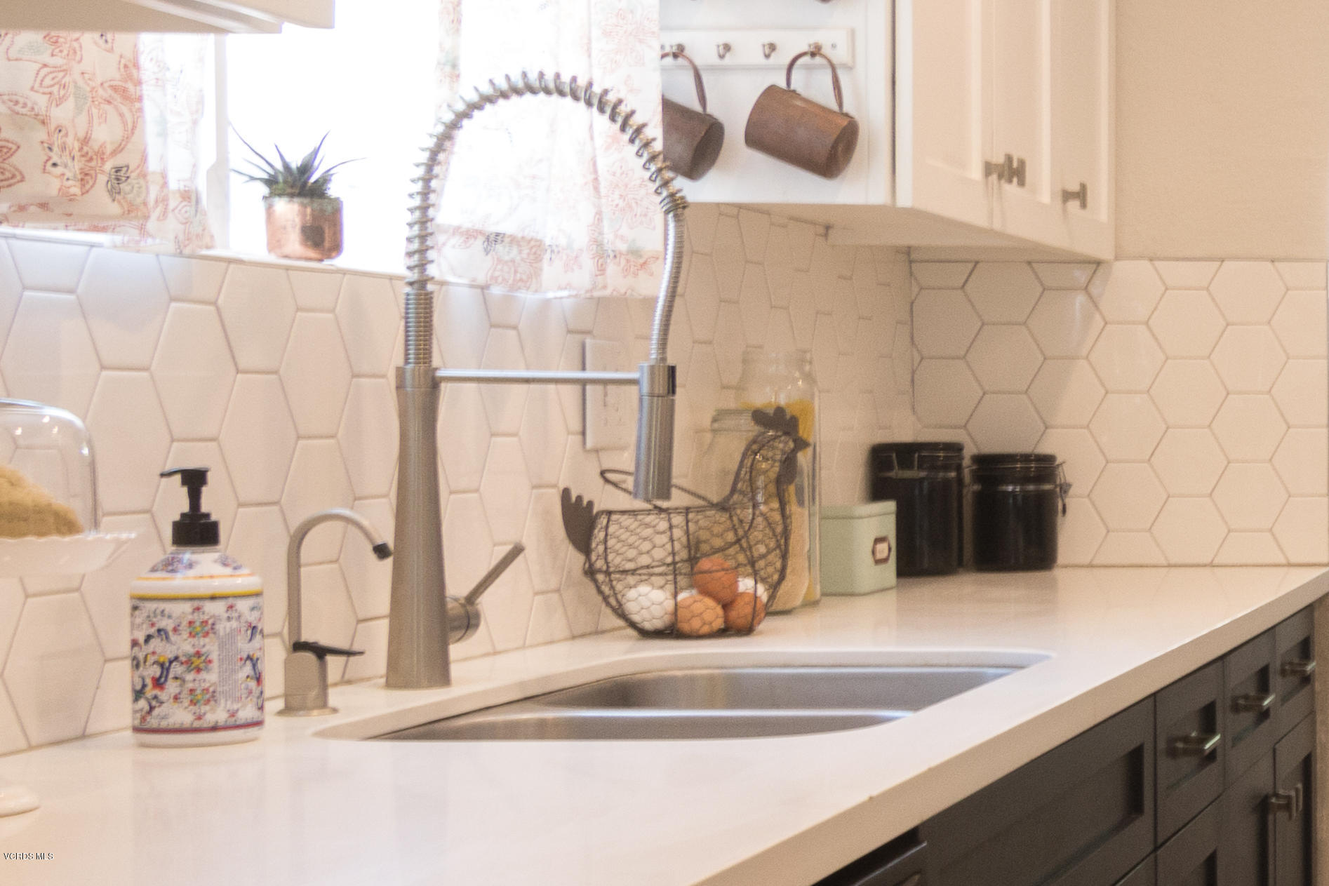108 Drown Avenue Ojai, CA 93023 - Photo 9 of 37 a close view of sink and a mirror