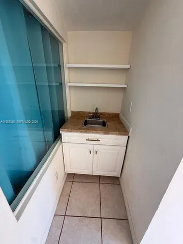 a living room with a couch and a dryer