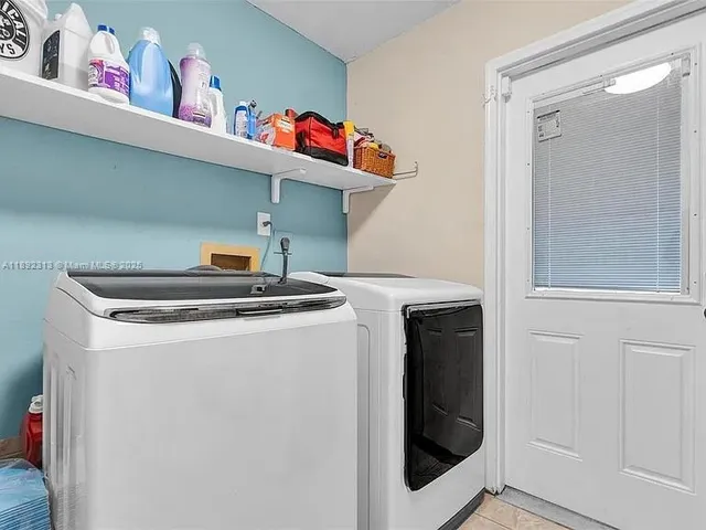 a utility room with dryer and washer