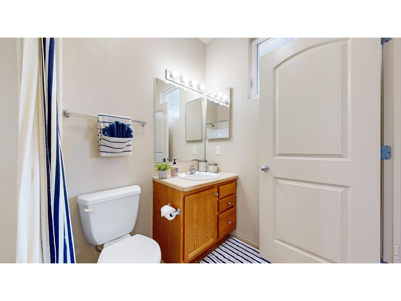 4672 West 20th Road, Unit 413 Greeley, CO 80634 - Photo 28 of 37 a bathroom with a sink toilet and shower