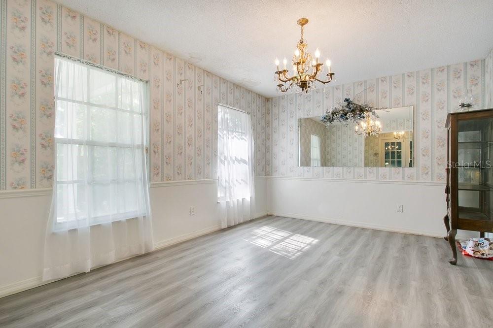 412 Forest Street Windermere, FL 34786 - Photo 8 of 34 wooden floor in an empty room with a window