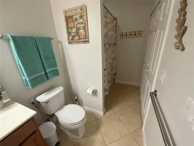 a view of a dining room with furniture and a window