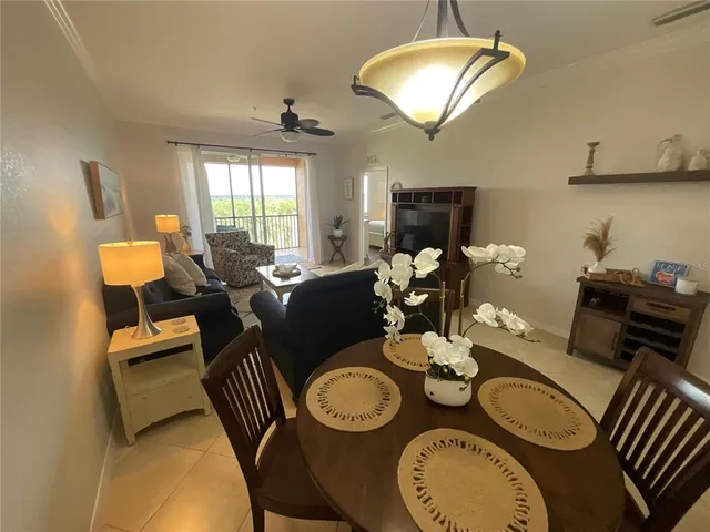 a spacious bedroom with a bed and a flat screen tv