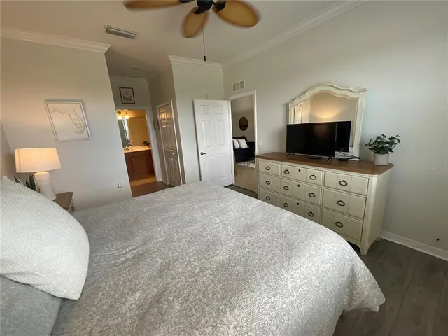 a living room with furniture a rug and a chandelier