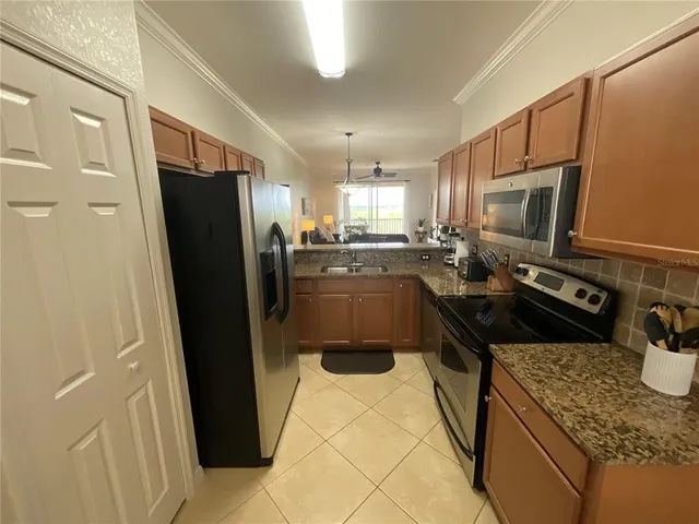 a bathroom with a sink a toilet a mirror and vanity
