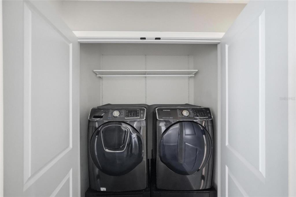 2013 Sunset Wind Loop Oldsmar, FL 34677 - Photo 28 of 43 a utility room with dryer and washer