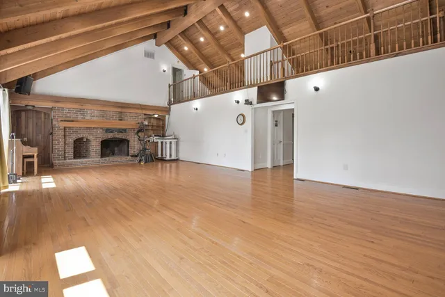 a view of a livingroom with wooden floor