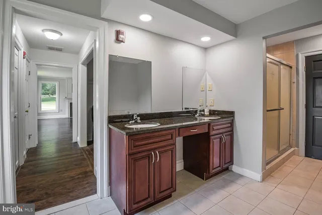 a kitchen with stainless steel appliances granite countertop a stove and a refrigerator