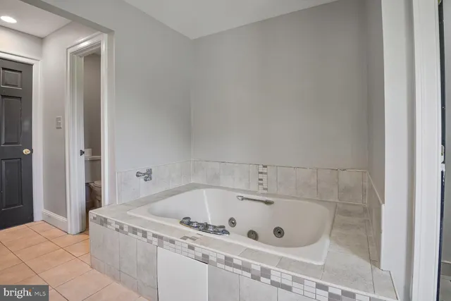 a bathroom with bathtub in it