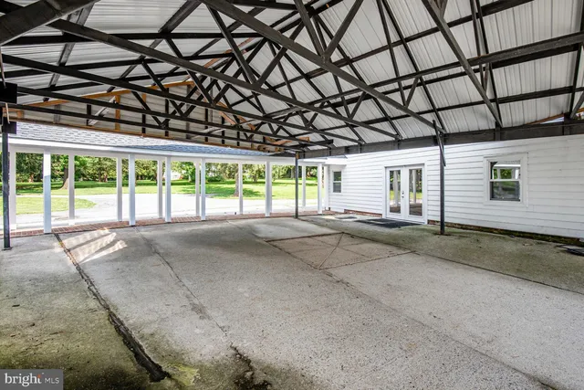 a front view of a house with yard and garage