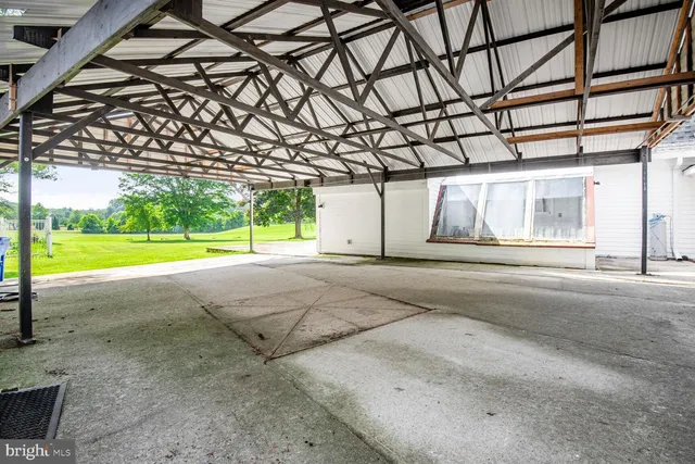 a picture of a bench in front of a wall