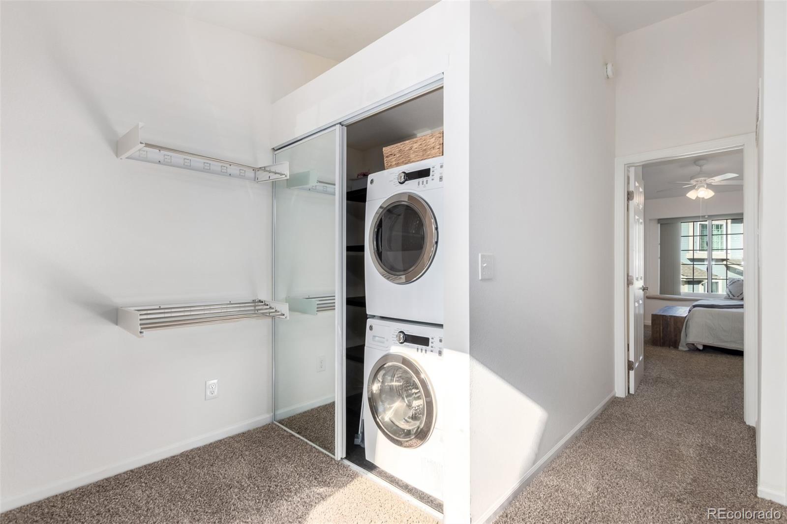 1885 South Quebec Way, Unit B22 Denver, CO 80231 - Photo 21 of 47 a utility room with sink dryer and washer