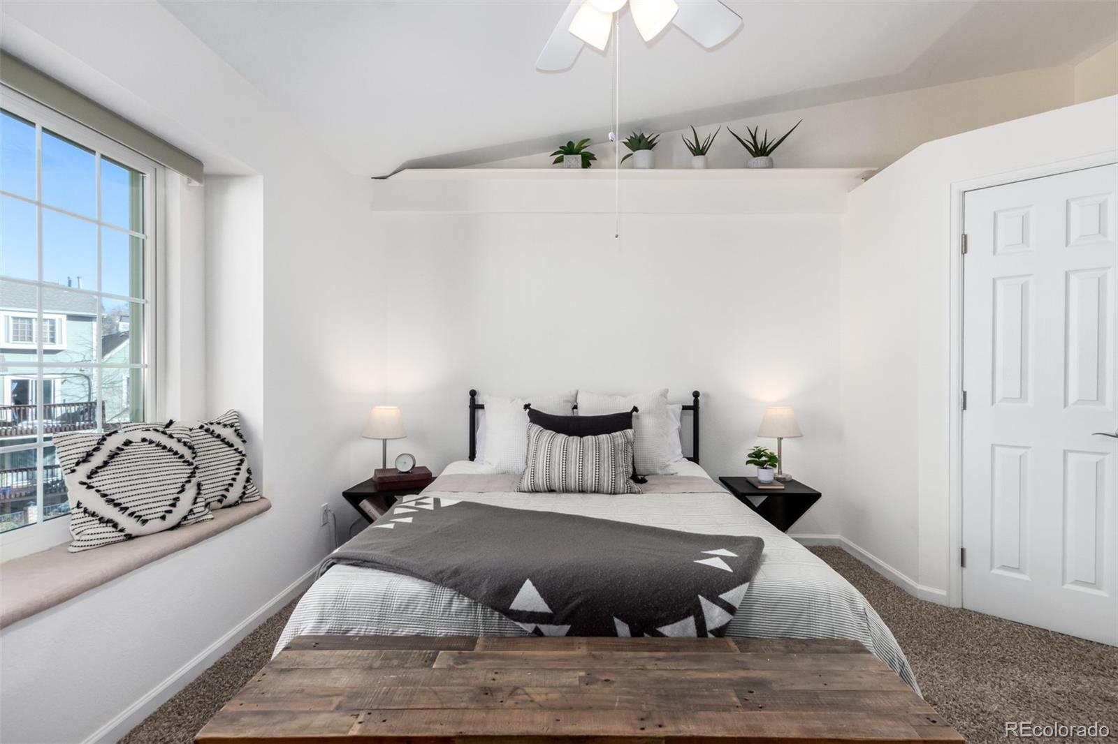 1885 South Quebec Way, Unit B22 Denver, CO 80231 - Photo 22 of 47 a bed room with a bed and a couch