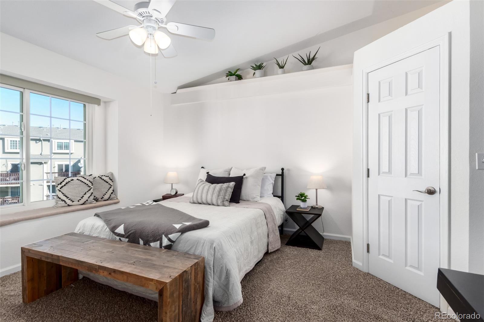 1885 South Quebec Way, Unit B22 Denver, CO 80231 - Photo 24 of 47 a bedroom with bed and a window