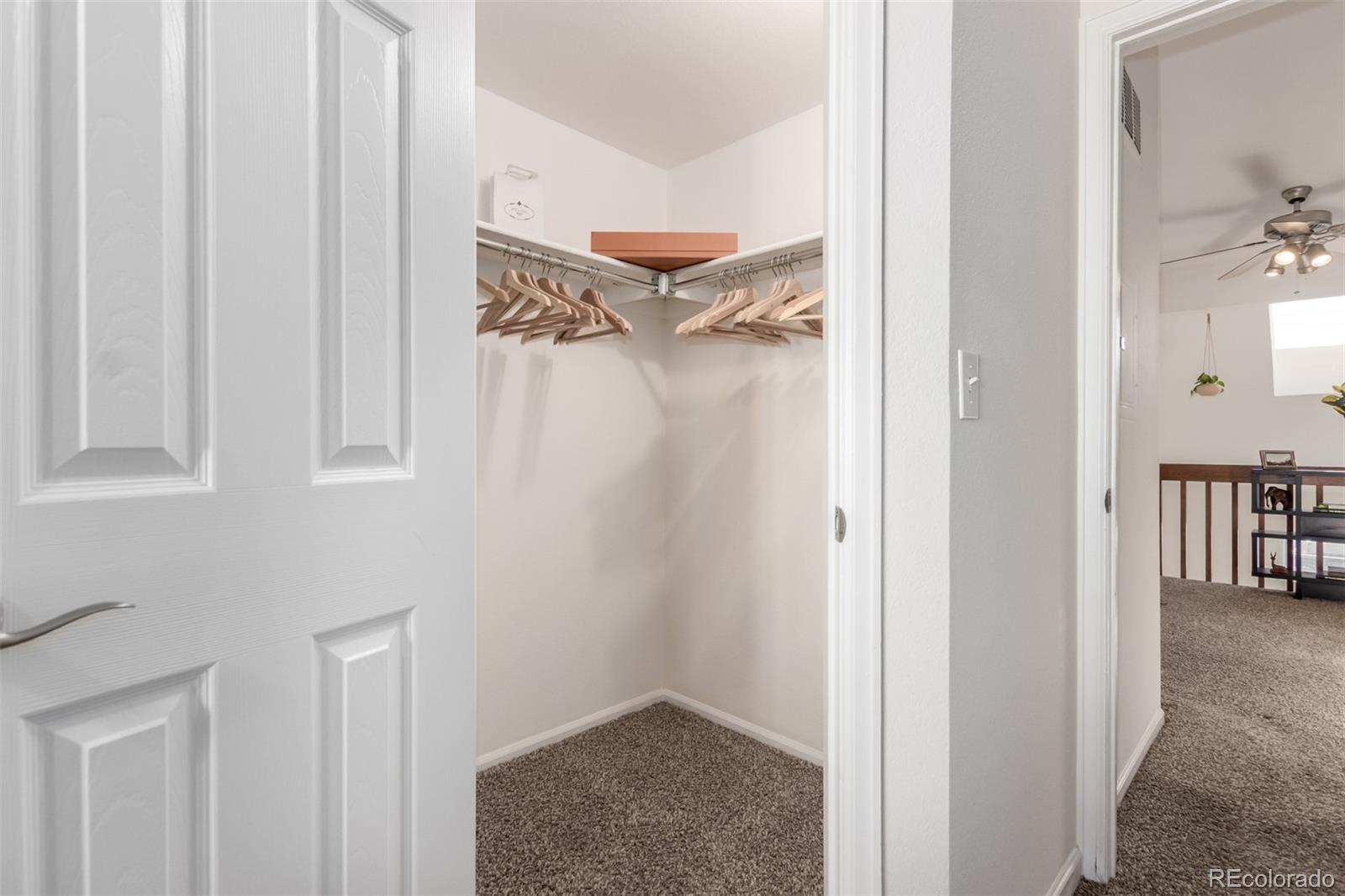 1885 South Quebec Way, Unit B22 Denver, CO 80231 - Photo 25 of 47 a view of a bedroom from a hallway