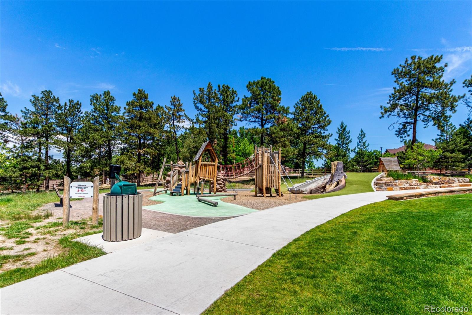 1885 South Quebec Way, Unit B22 Denver, CO 80231 - Photo 40 of 47 a view of a park with swings and slides