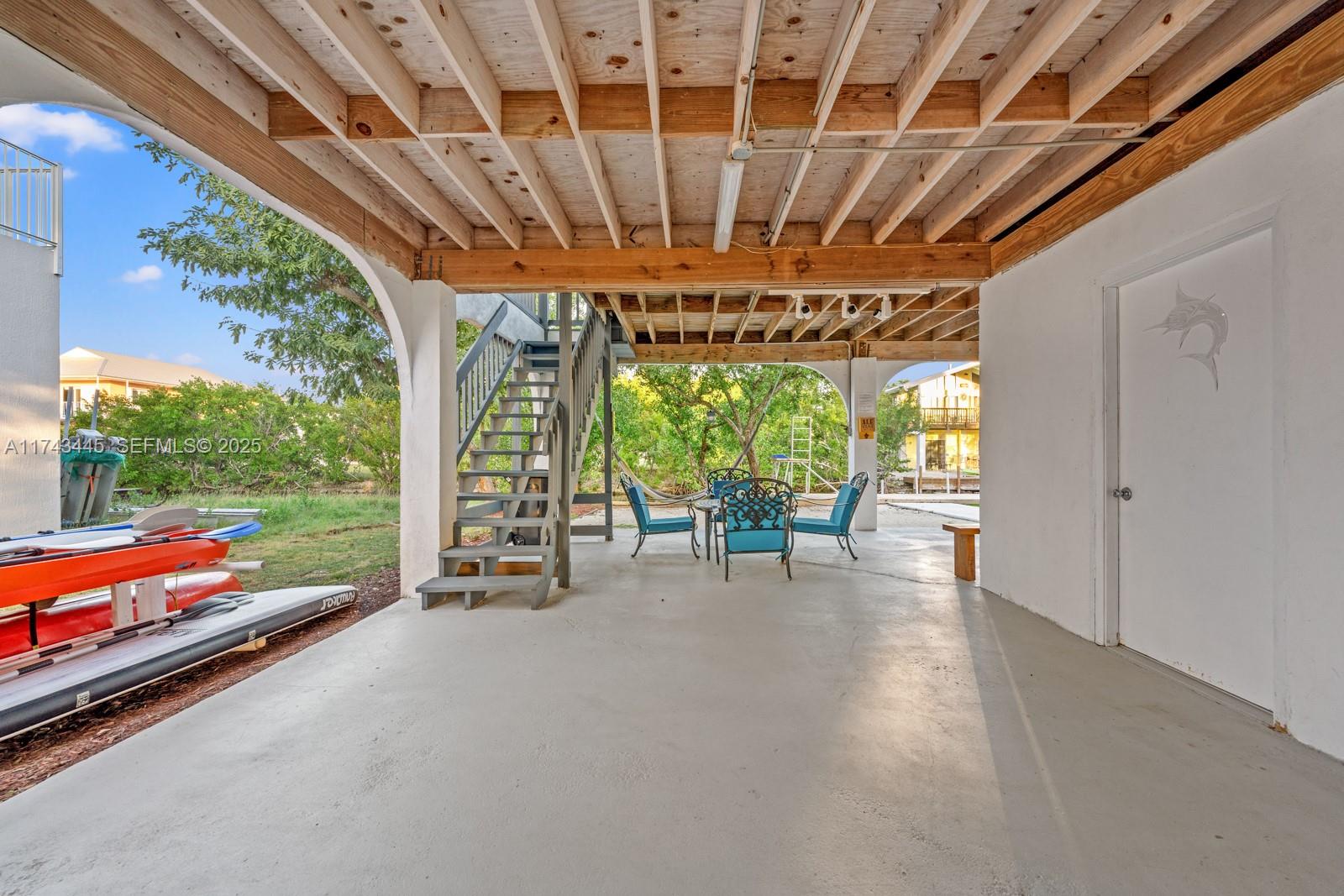 3635 Tradewinds Street Big Pine Key, FL 33043 - Photo 11 of 41 a view of outdoor space with porch and outdoor seating