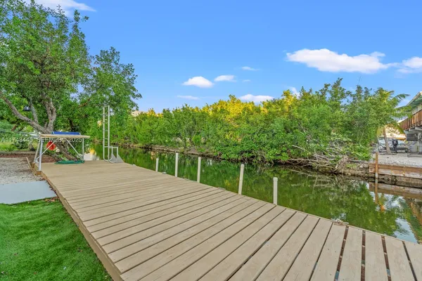 a view of a wooden deck with a garden