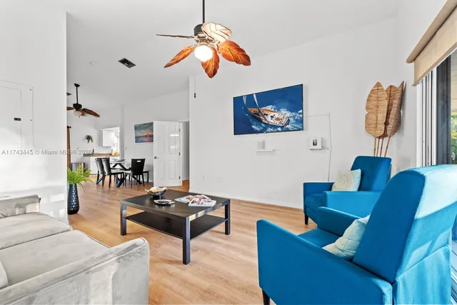 a living room with furniture and a window