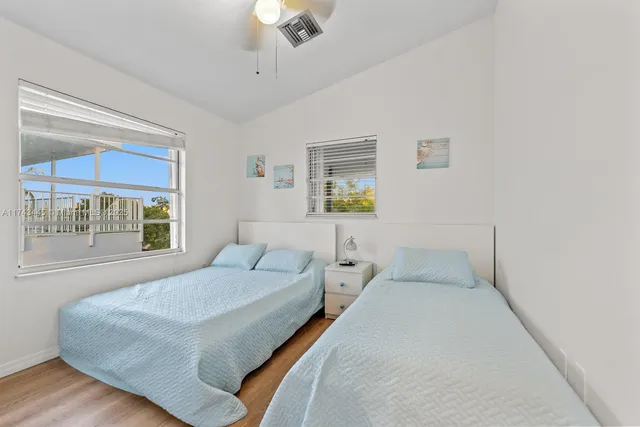 a view of a hallway and closet with a mirror