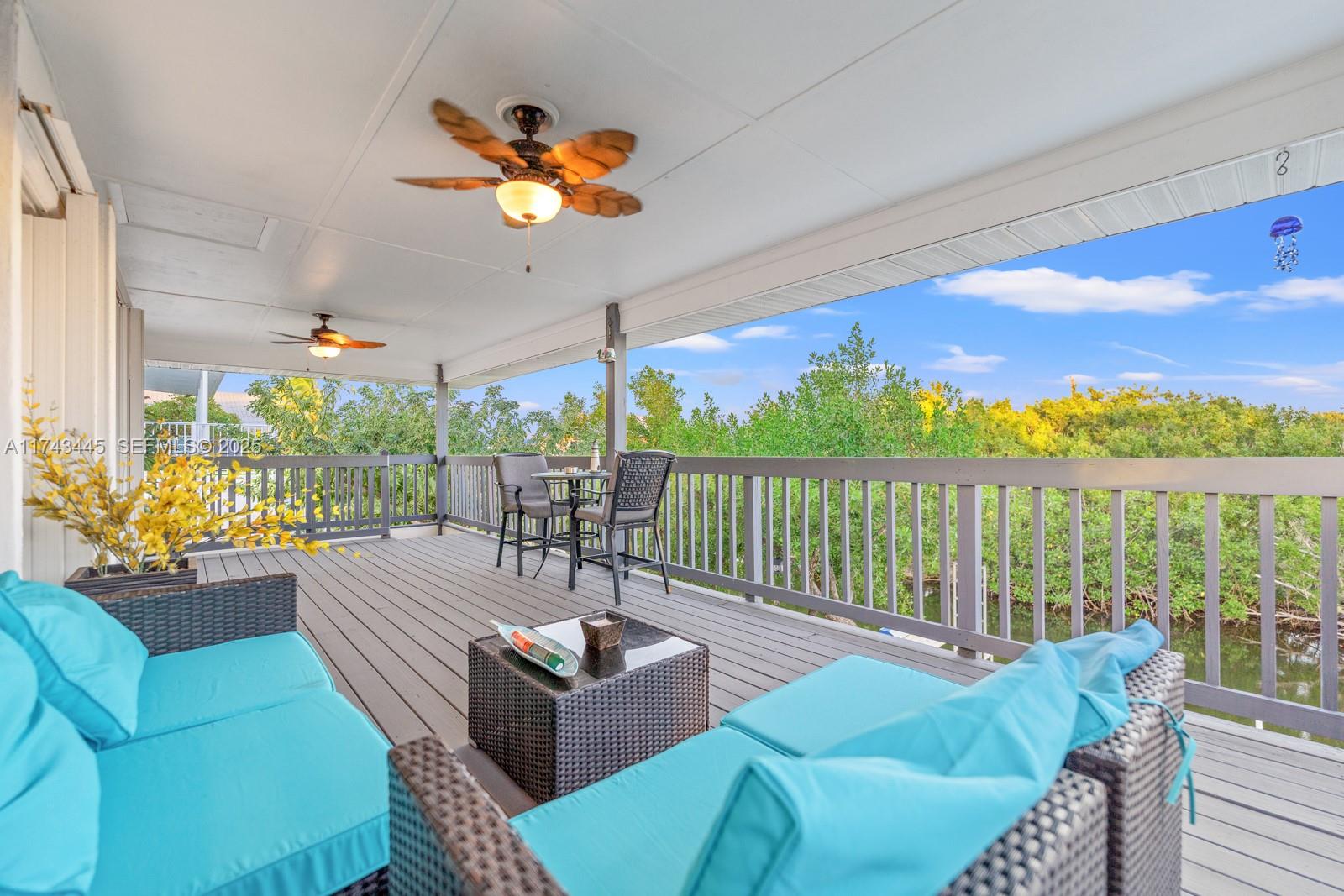 3635 Tradewinds Street Big Pine Key, FL 33043 - Photo 37 of 41 a view of a balcony with furniture