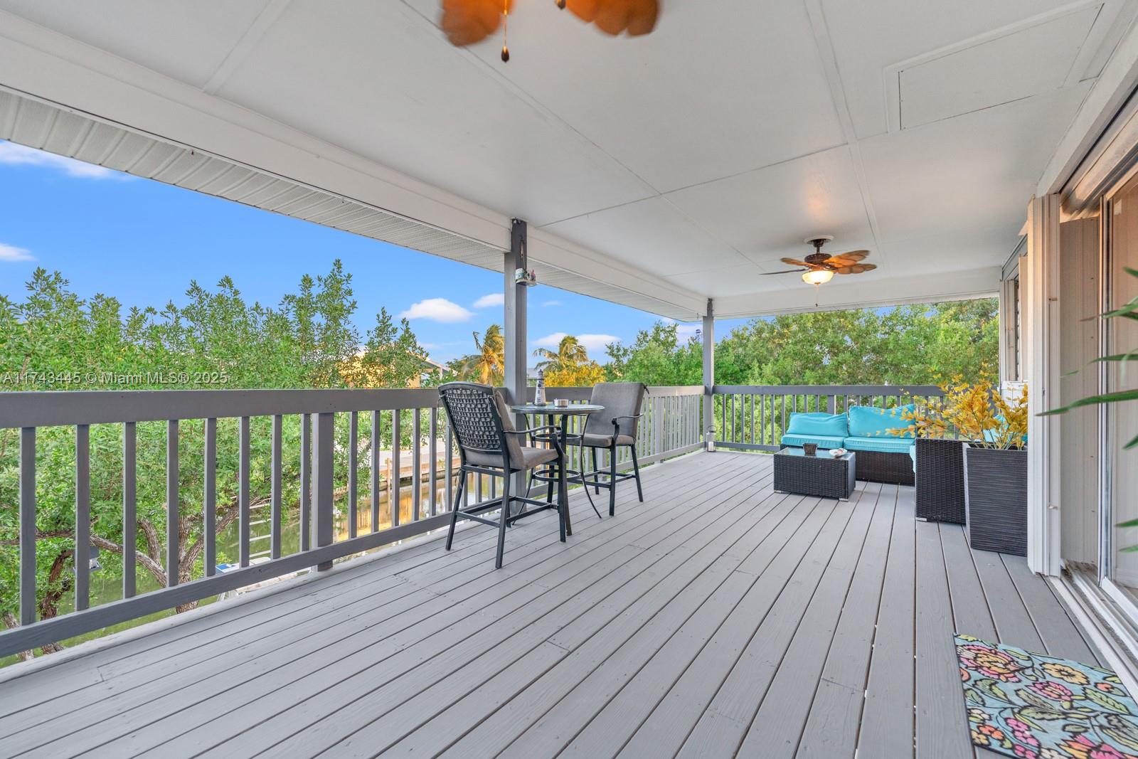 3635 Tradewinds Street Big Pine Key, FL 33043 - Photo 39 of 41 a view of a patio with wooden floor