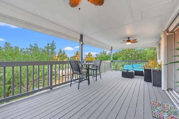 a view of a patio with wooden floor