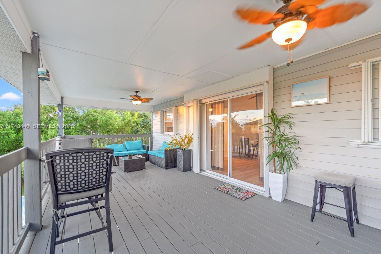3635 Tradewinds Street Big Pine Key, FL 33043 - Photo 40 of 41 a balcony with furniture and a potted plant
