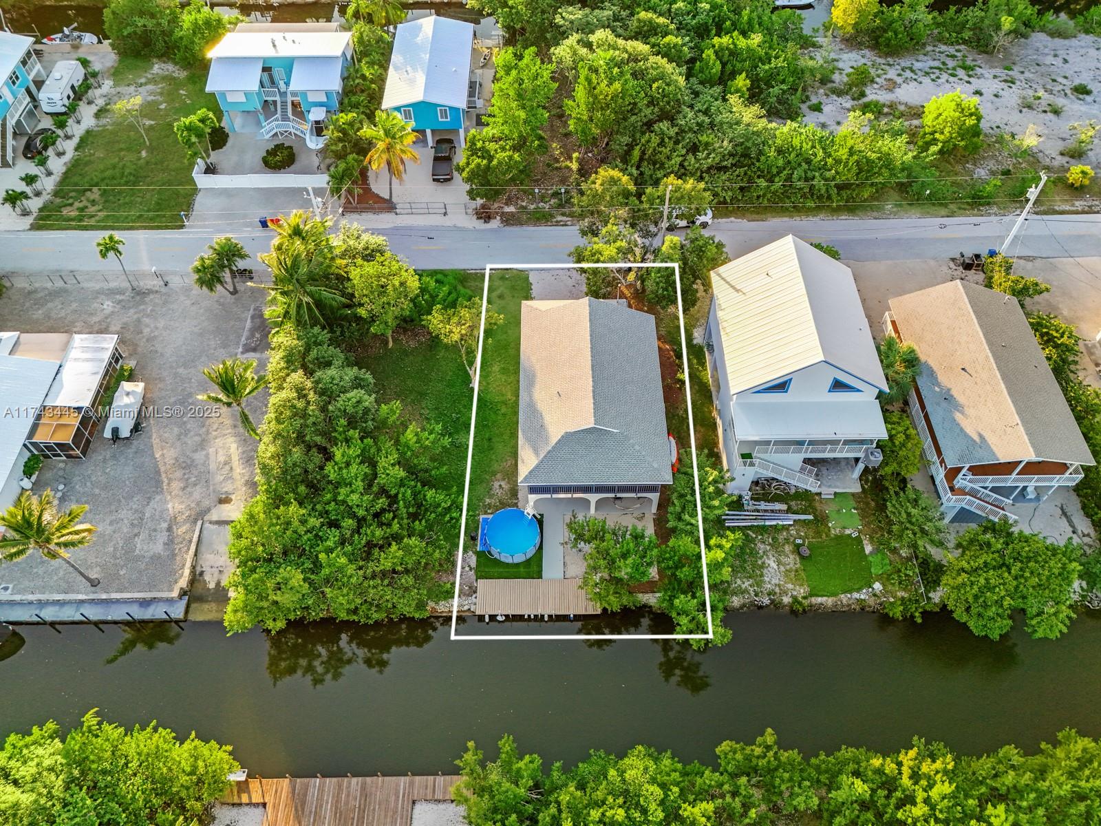 3635 Tradewinds Street Big Pine Key, FL 33043 - Photo 8 of 41 an aerial view of a house with a lake view