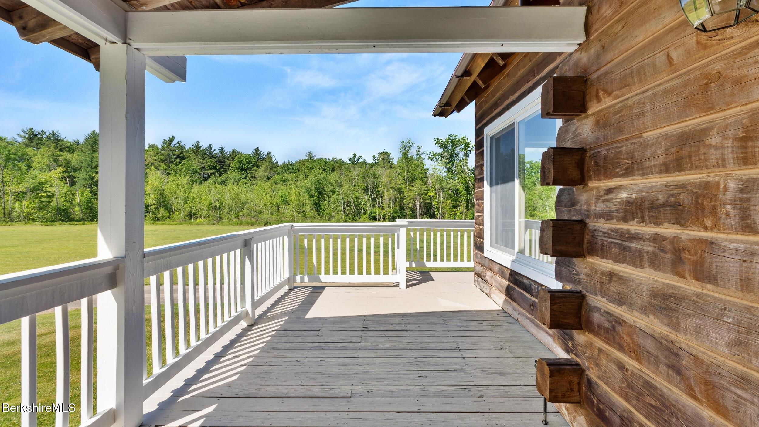 134 Hurlburt Road Great Barrington, MA 01230 - Photo 42 of 50 a view of balcony with wooden floor and fence