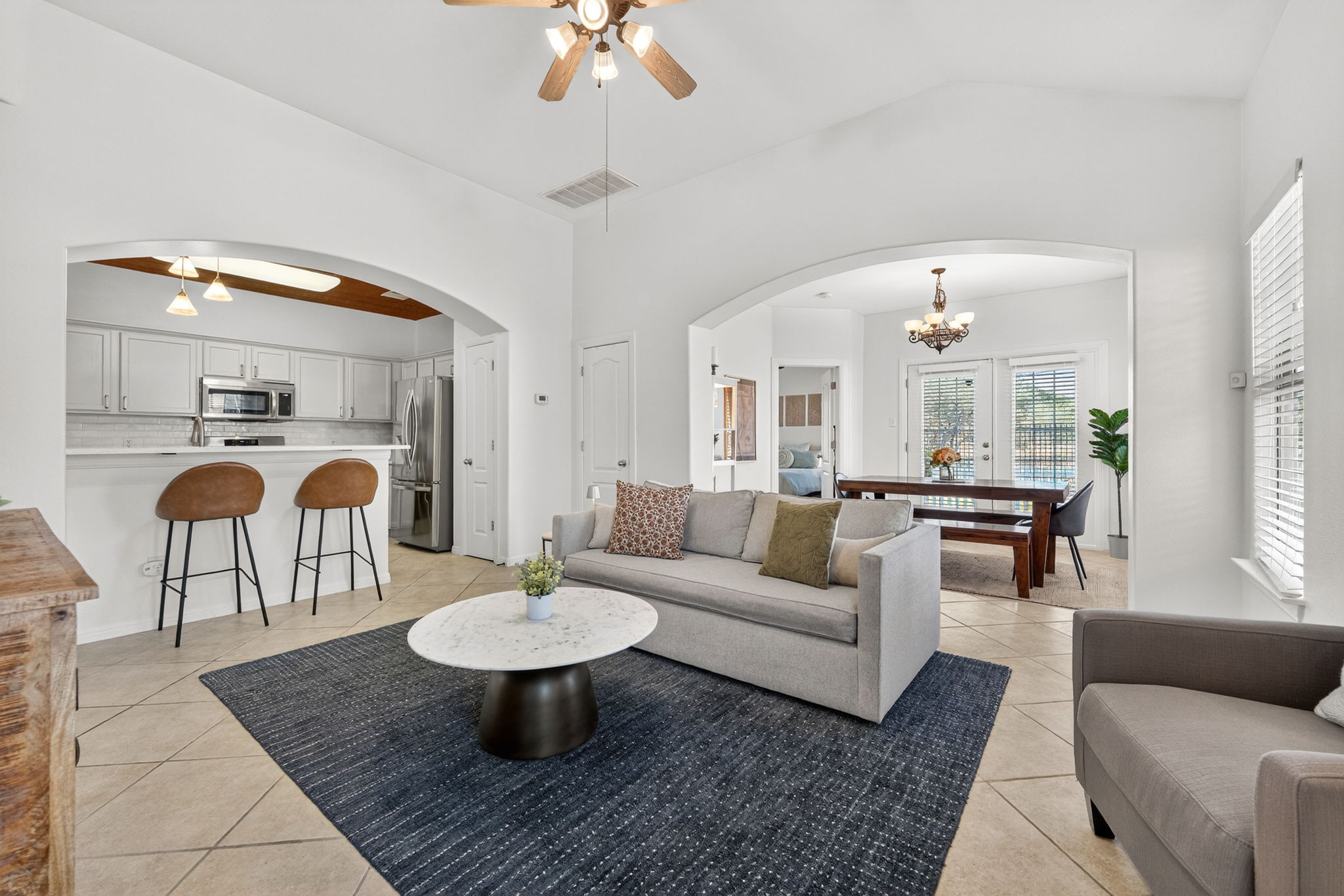6801 Beckett Road, Unit 114R Austin, TX 78749 - Photo 2 of 21 a living room with furniture and a chandelier