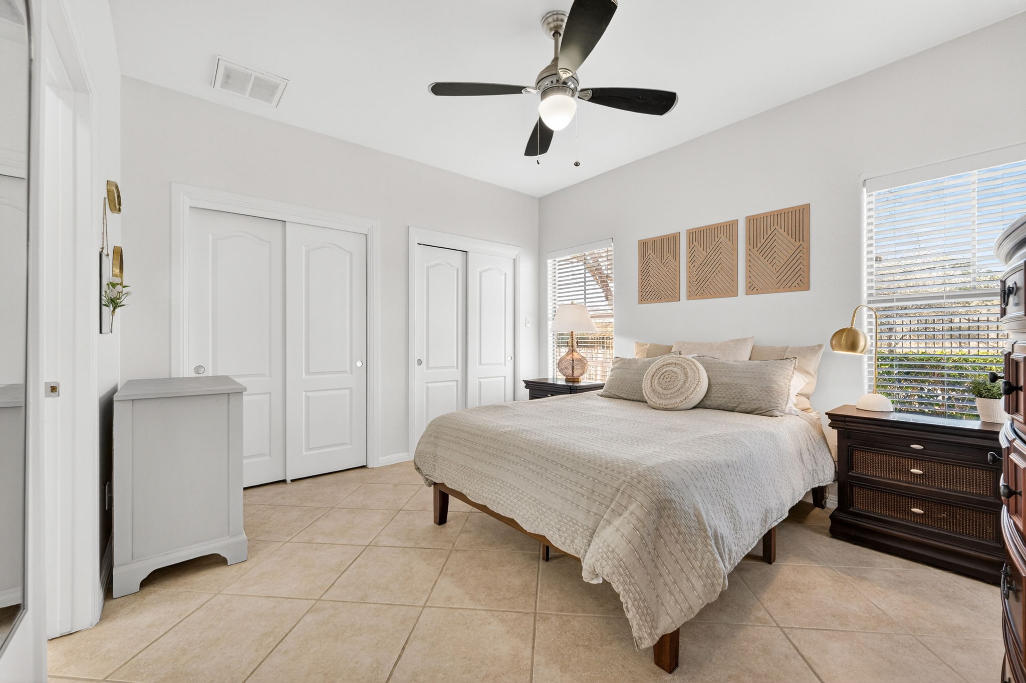 6801 Beckett Road, Unit 114R Austin, TX 78749 - Photo 10 of 21 a bedroom with a bed and a ceiling fan
