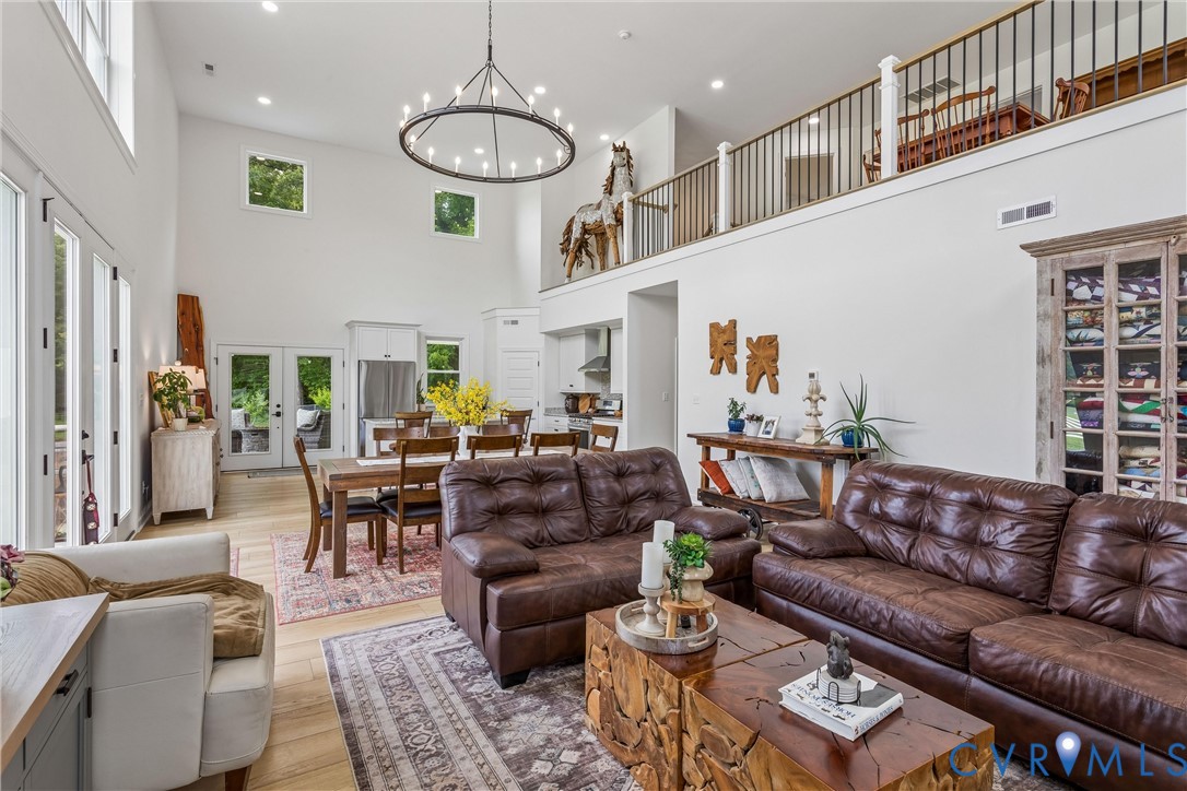 2016 Forge Road Toano, VA 23168 - Photo 51 of 99 Vaulted ceilings with an overhead chandelier and r