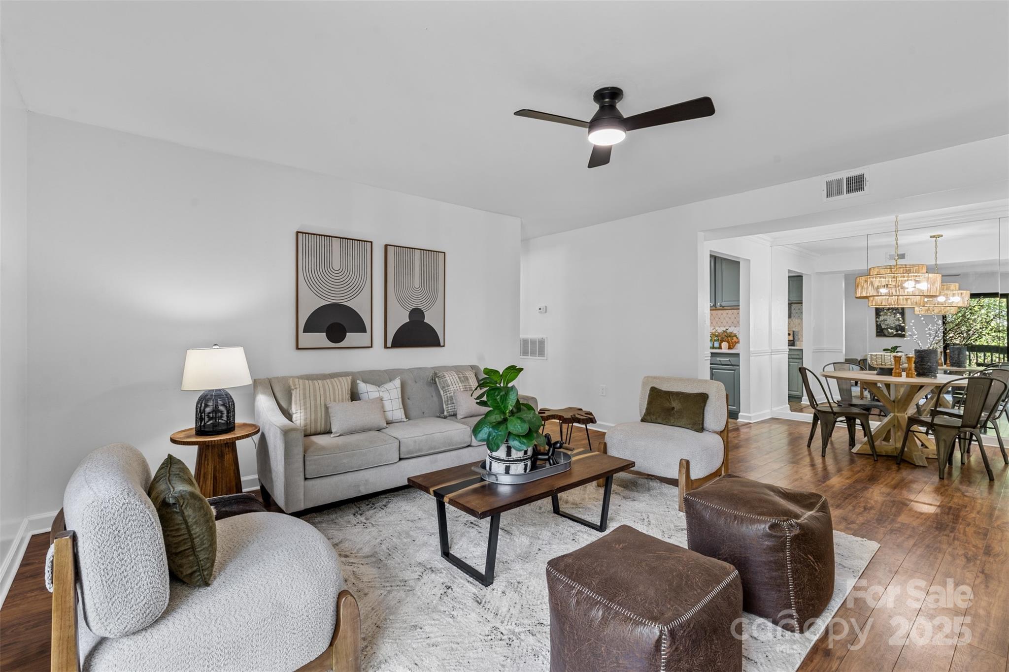 a living room with furniture and a table