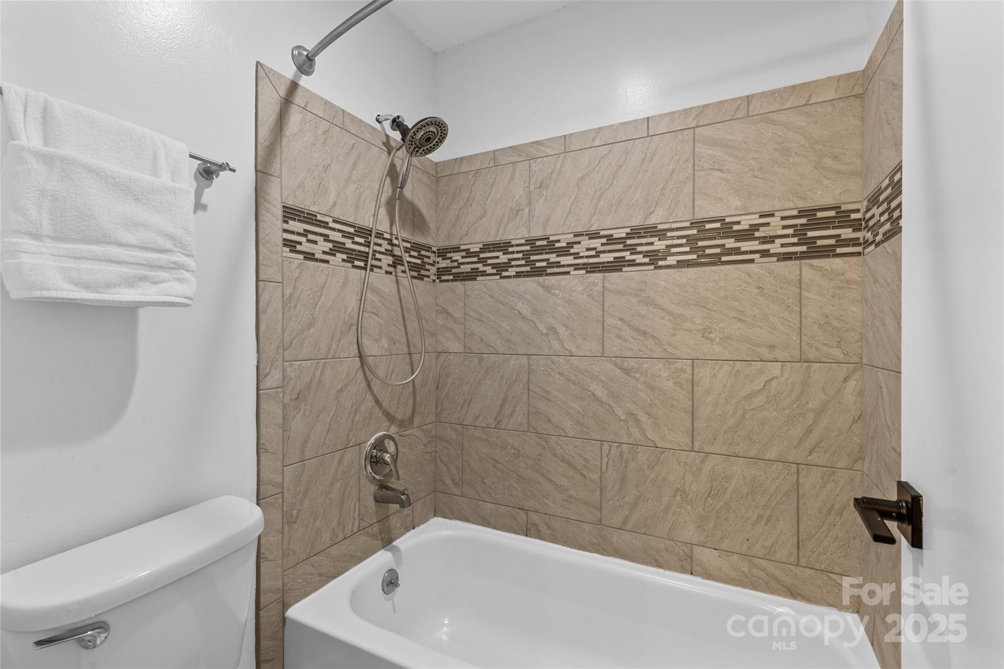 5016 Sardis Road, Unit G Charlotte, NC 28270 - Photo 15 of 24 a bathroom with a sink a toilet and shower