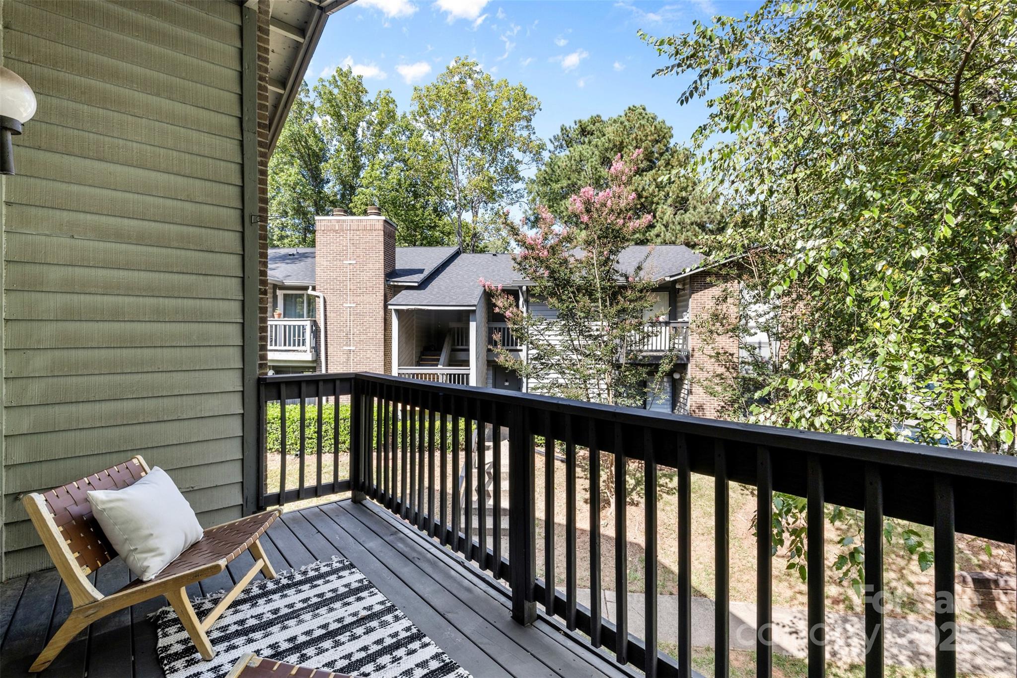 5016 Sardis Road, Unit G Charlotte, NC 28270 - Photo 21 of 24 a view of a balcony with wooden floor
