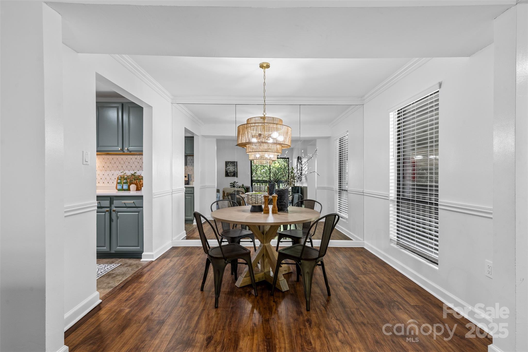 5016 Sardis Road, Unit G Charlotte, NC 28270 - Photo 4 of 24 a view of a dining room with furniture window and wooden floor